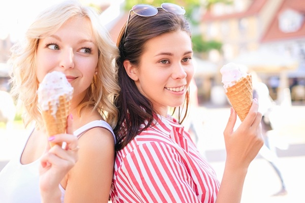 Friendship. Women with ice cream outdoor